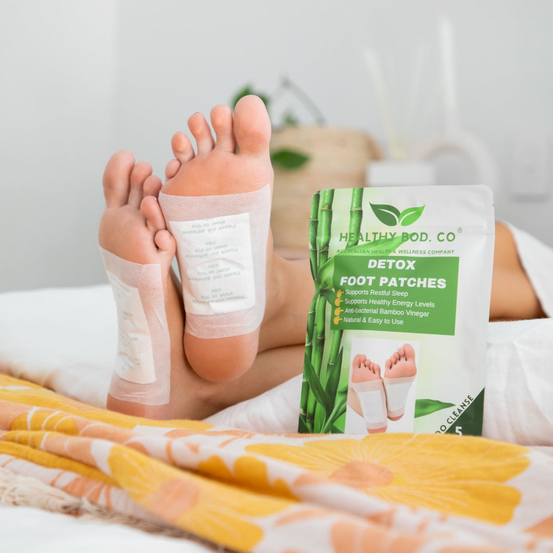 Feet wearing bamboo detox foot pads front view