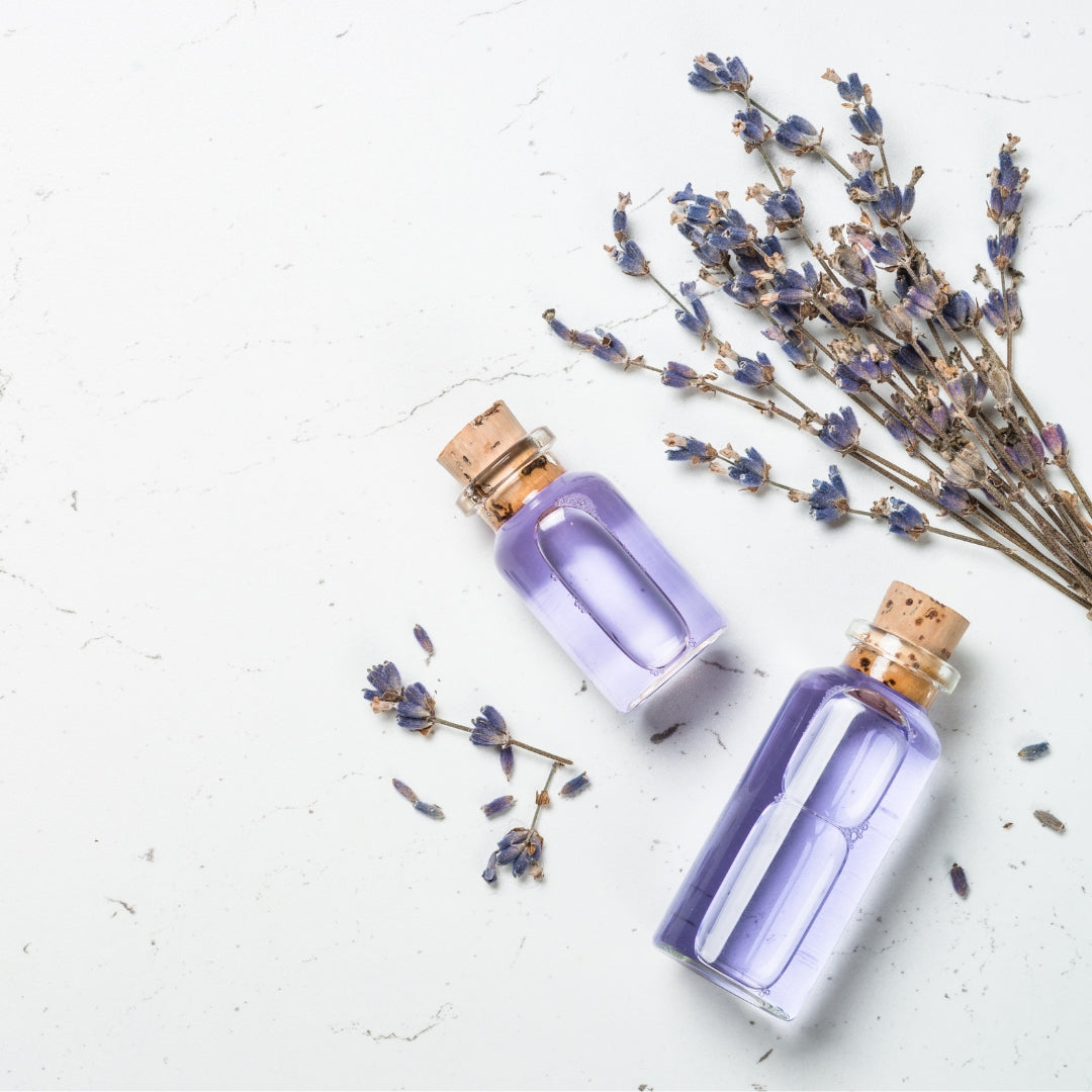An image of lavender essential oil next to lavender plant creative photo