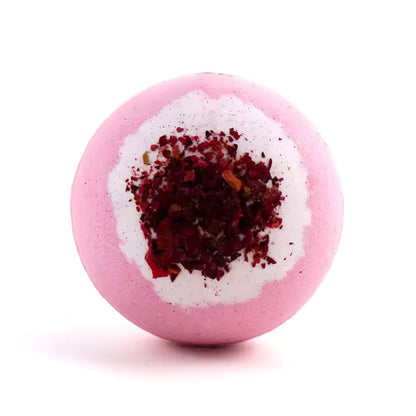 Photo of a rose bath bomb with dried rose petals in the centre.