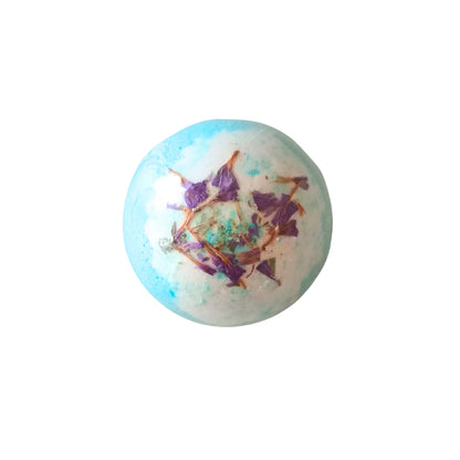 Photo of the blue orchid bath bomb with the dried flowers in the centre of the bath bomb.