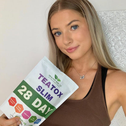 An image of a woman holding the Healthy Bod CO TeaTox Slim tea. Teatox Slimming Tea: Your Daily Metabolism Kickstart